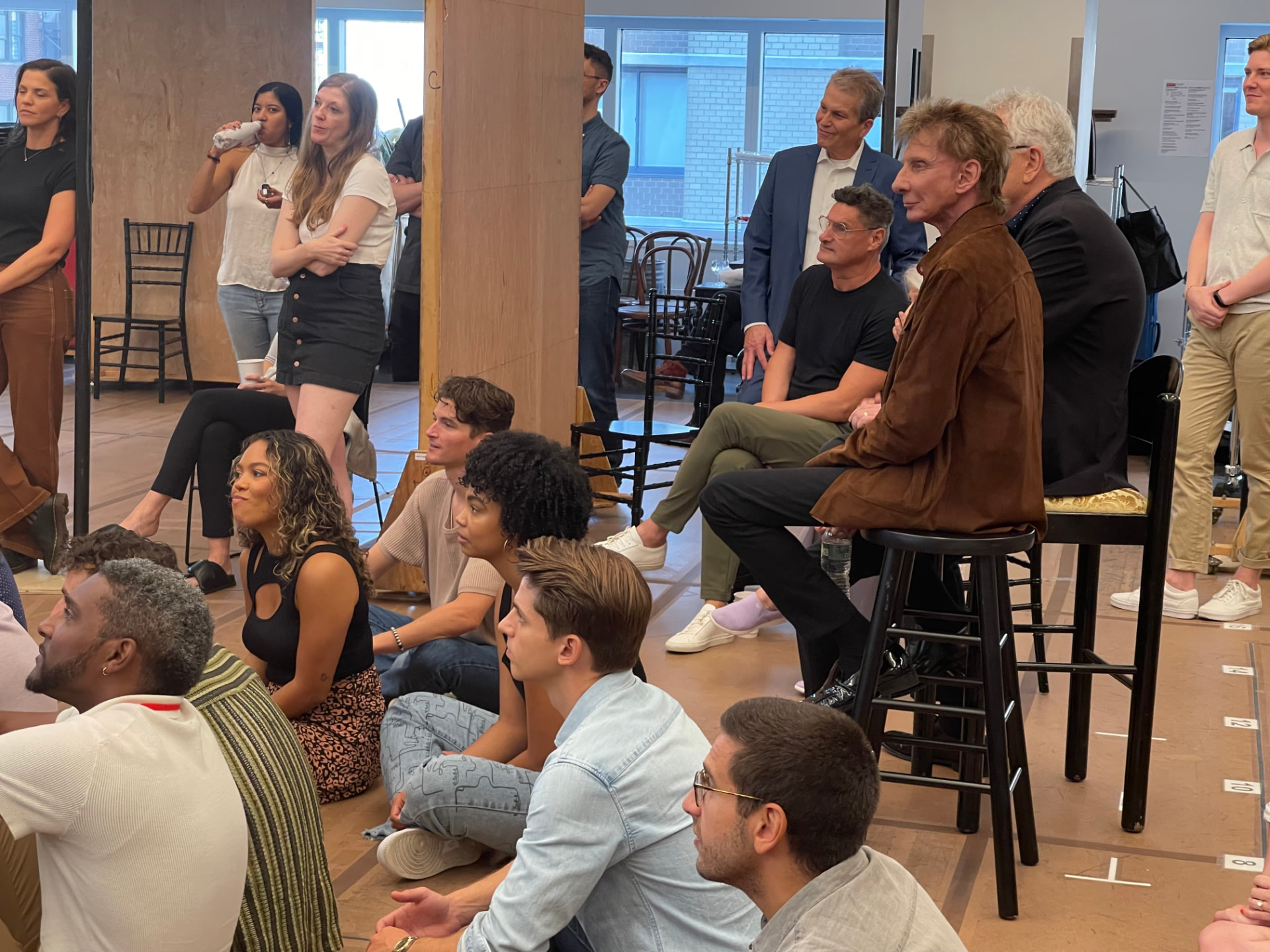 The Harmony company and creative team gathered together in the rehearsal room